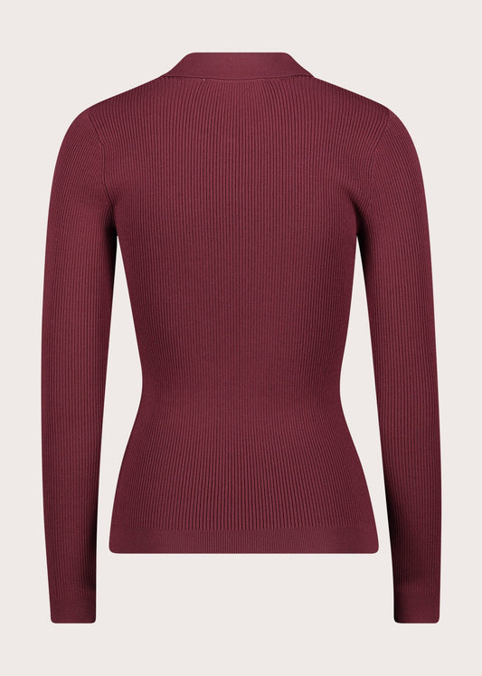 Polo da donna con bottoni dorati