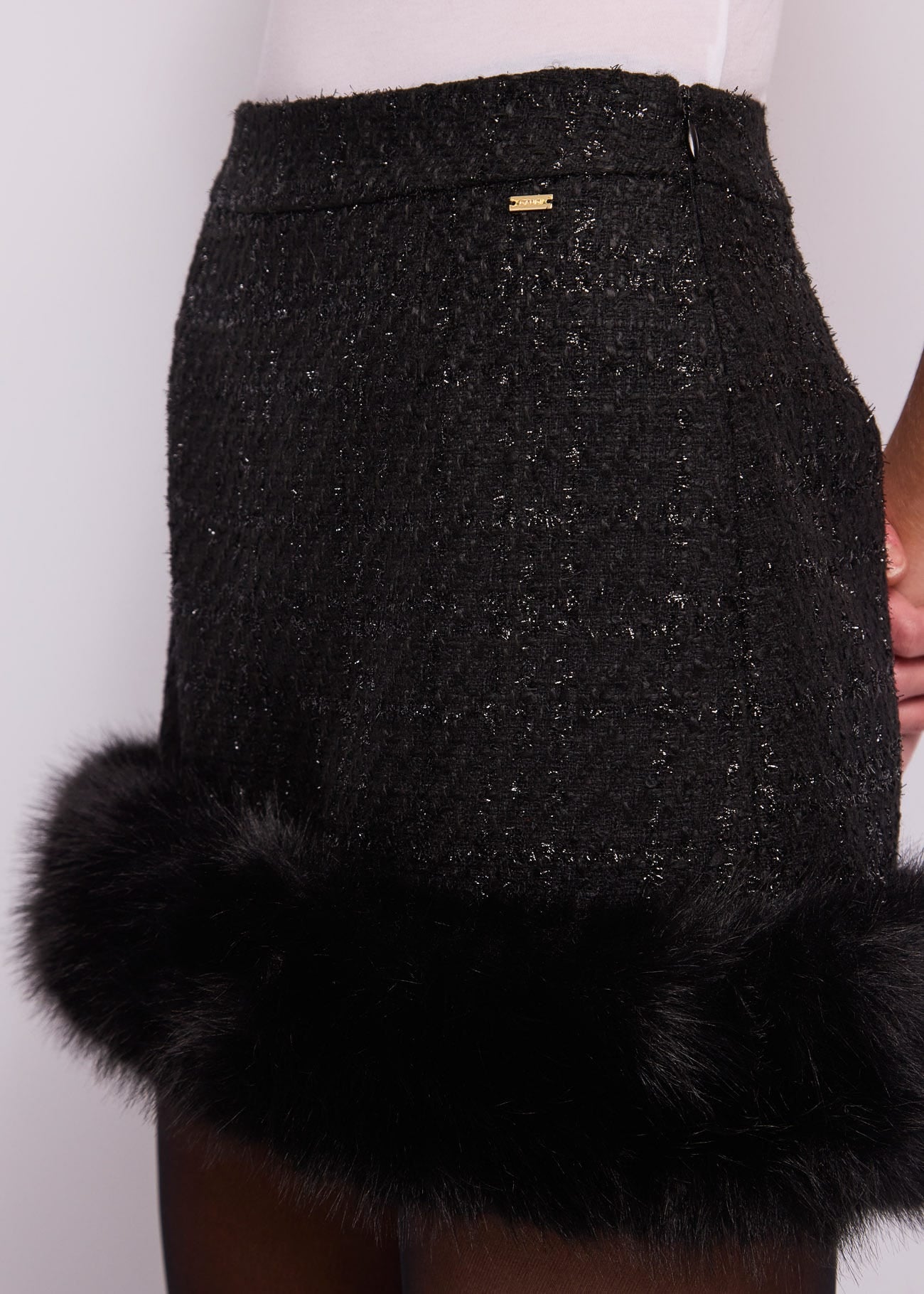 Minigonna lurex con ecopelliccia